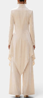 Mahaute Cosima velvet ensemble featuring a beige high-neck asymmetrical tunic and wide-leg trousers, back view.