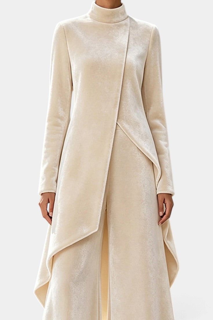 Mahaute Cosima cream velvet set featuring an asymmetrical tunic with a high neck and matching wide-leg trousers.
