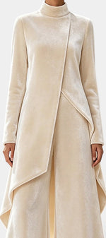 Mahaute Cosima cream velvet set featuring an asymmetrical tunic with a high neck and matching wide-leg trousers.