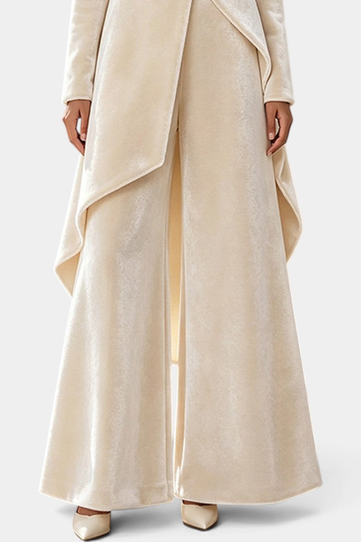 Mahaute Cosima cream velvet ensemble featuring an asymmetrical tunic with draped panels and wide-leg trousers.