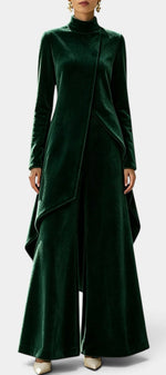Mahaute Cosima dark green velvet ensemble with an asymmetrical tunic, high neck, and wide-leg trousers.
