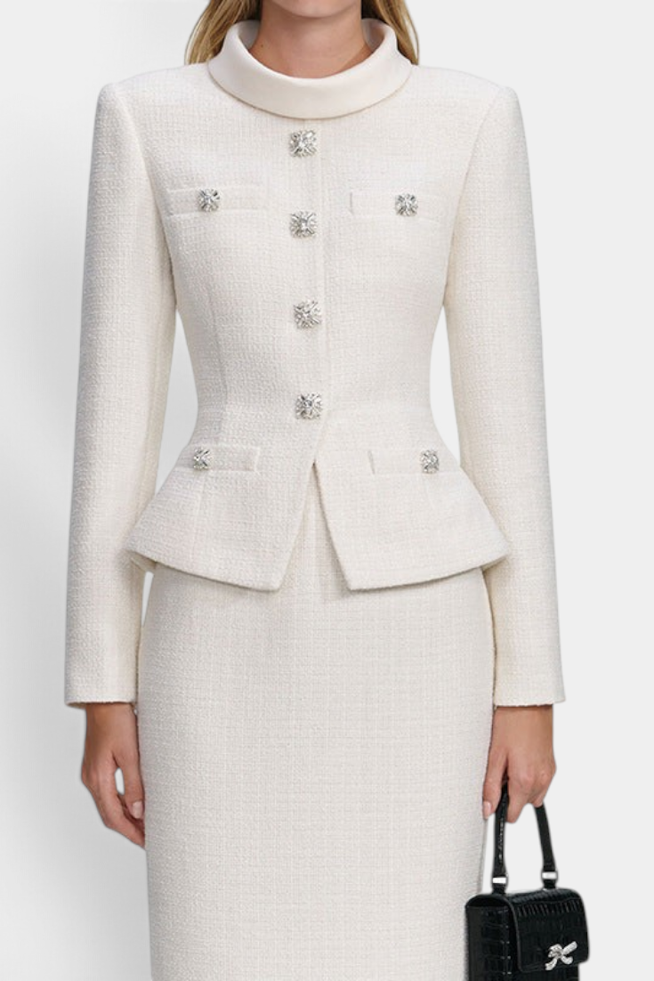 Mahaute Gergana cream structured skirt suit with a high collar and sparkling jewel buttons on the fitted jacket.