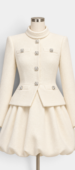 Mahaute Miglena cream structured jacket with square jewel buttons and matching voluminous bubble skirt on a mannequin.