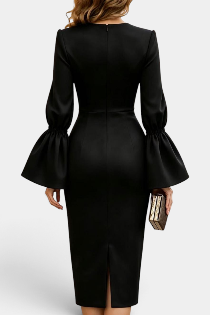 Back view of Mahaute Demelza black midi sheath dress with flared sleeves and a back slit on a model