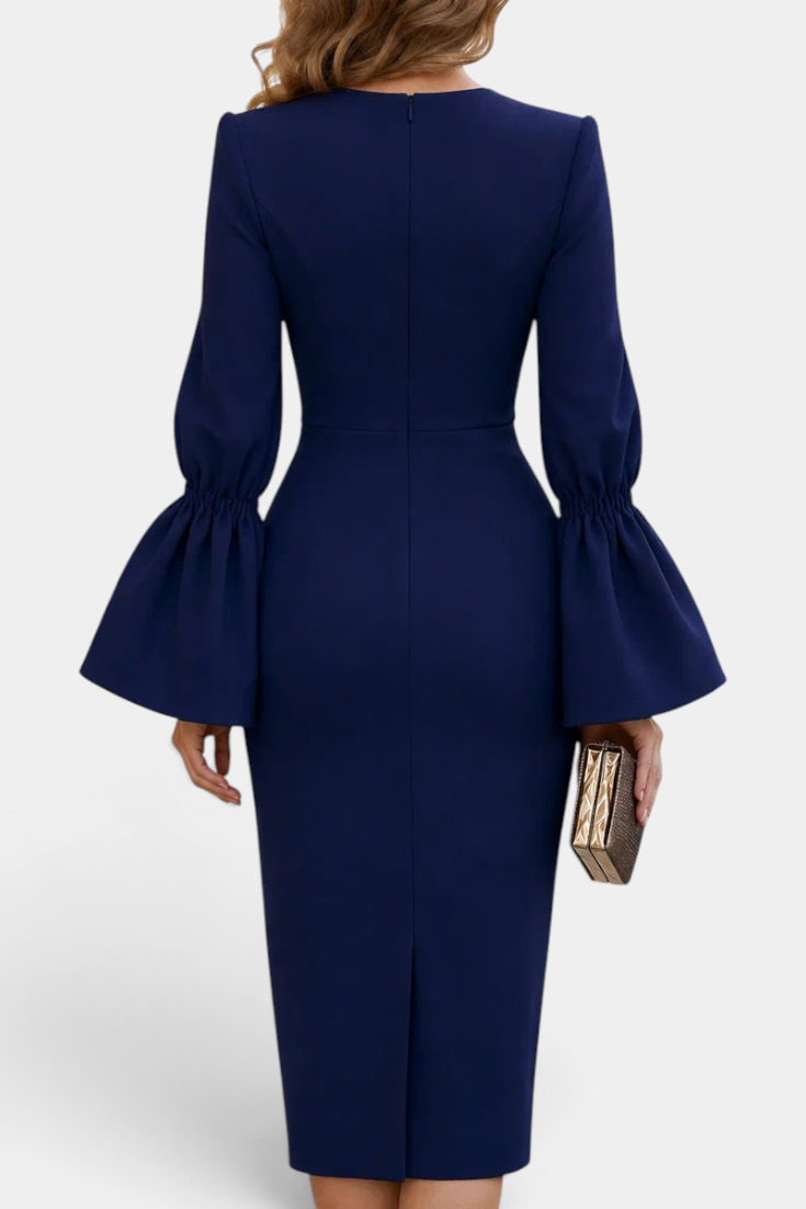 Back view of Mahaute Demelza navy blue midi sheath dress with dramatic flared sleeves and a back slit