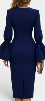 Back view of Mahaute Demelza navy blue midi sheath dress with dramatic flared sleeves and a back slit