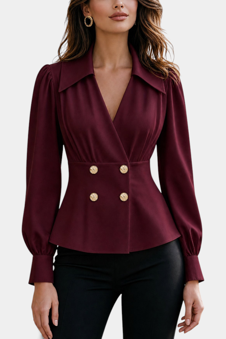 Mahaute Denovia burgundy tailored blouse with crossover neckline, cinched waist, and decorative gold buttons.