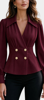 Mahaute Denovia burgundy tailored blouse with crossover neckline, cinched waist, and decorative gold buttons.