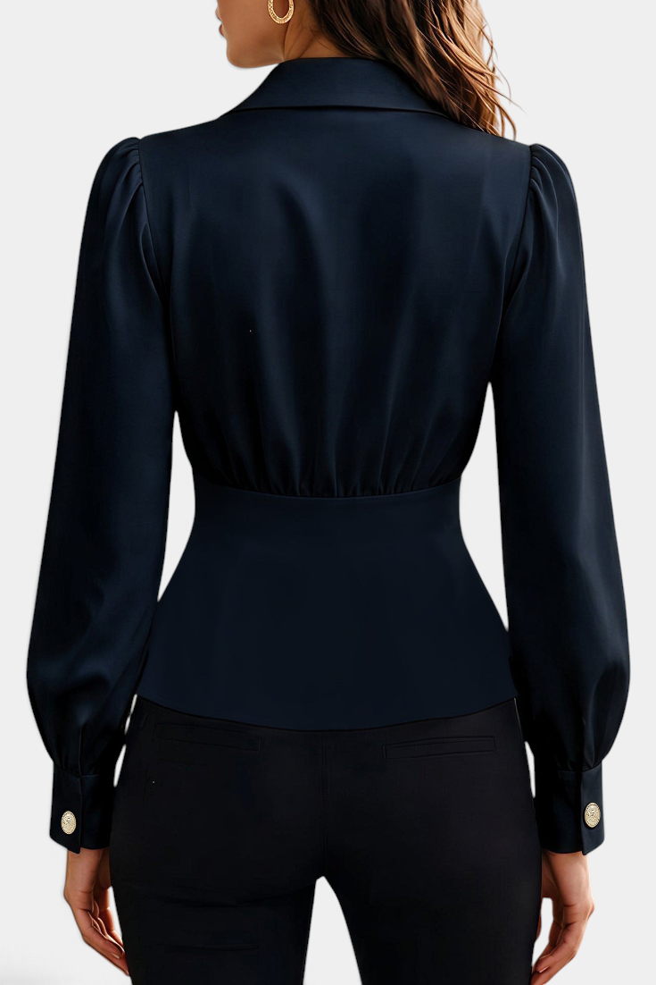 Mahaute Denovia navy blue tailored blouse with long puff sleeves and gold button cuffs, back view.