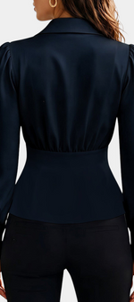 Mahaute Denovia navy blue tailored blouse with long puff sleeves and gold button cuffs, back view.