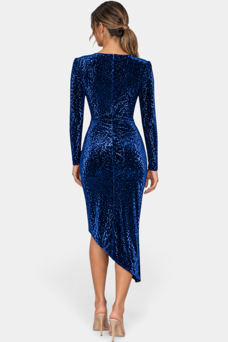 Back view of a Mahaute blue sequin midi dress with long sleeves and an asymmetrical hemline on a model
