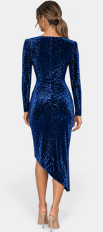 Back view of a Mahaute blue sequin midi dress with long sleeves and an asymmetrical hemline on a model