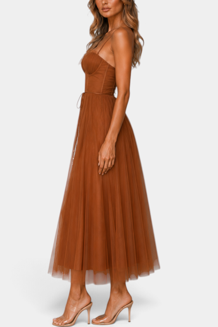Mahaute Eileen midi tulle dress in rust brown with a structured corset bodice and sweetheart neckline, side view.