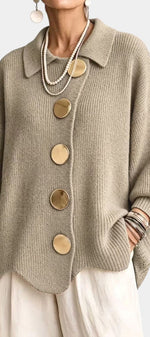 Mahaute Eleri beige oversized knit cardigan with a shirt collar, balloon sleeves, and large gold buttons.