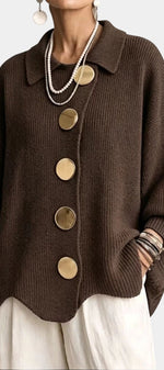 Mahaute Eleri brown oversized knit cardigan with a shirt collar, balloon sleeves, and large gold buttons.