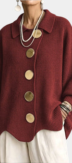 Mahaute Eleri oversized burgundy knit cardigan with a shirt collar, balloon sleeves, and large gold buttons.