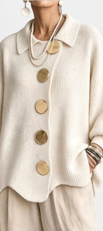 Mahaute Eleri cream knit oversized cardigan featuring a shirt collar, balloon sleeves, and large gold buttons.