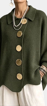 Mahaute Eleri oversized olive green knit cardigan with a shirt collar, balloon sleeves, and large gold buttons.