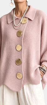 Mahaute Eleri oversized pink knit cardigan with a shirt collar, balloon sleeves, and large gold buttons.
