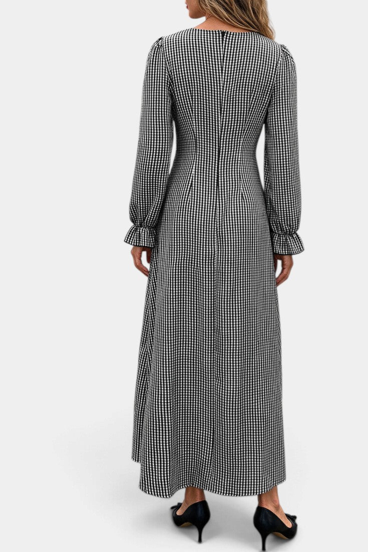 Back view of Mahaute Ethelinde long black and white gingham dress with long puff sleeves and ruffled cuffs