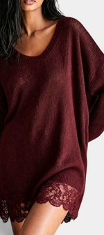 Mahaute Ethelreda burgundy oversized sweater dress with a scoop neckline, open-knit texture, and floral lace hem.