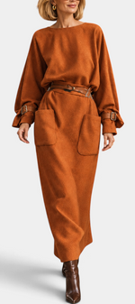 Mahaute long rust-colored belted dress with puff sleeves and patch pockets in a soft wool-blend fabric.
