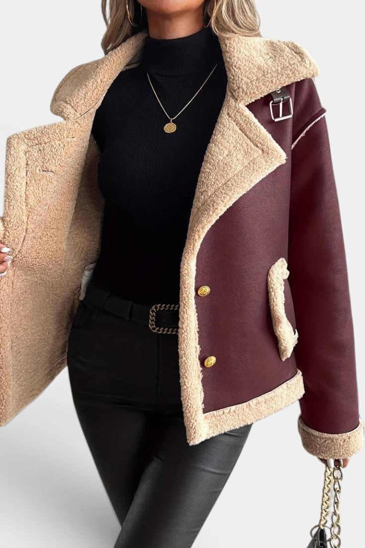 Mahaute Flynn short burgundy faux suede coat with cream faux fur collar, gold buttons, and contrast trim details.
