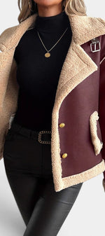 Mahaute Flynn short burgundy faux suede coat with cream faux fur collar, gold buttons, and contrast trim details.