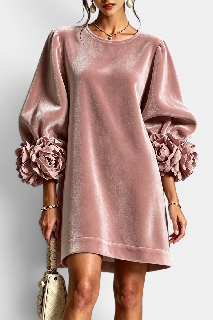 Mahaute Fuega short pink velvet dress with voluminous puff sleeves and 3D floral accents at the cuffs.