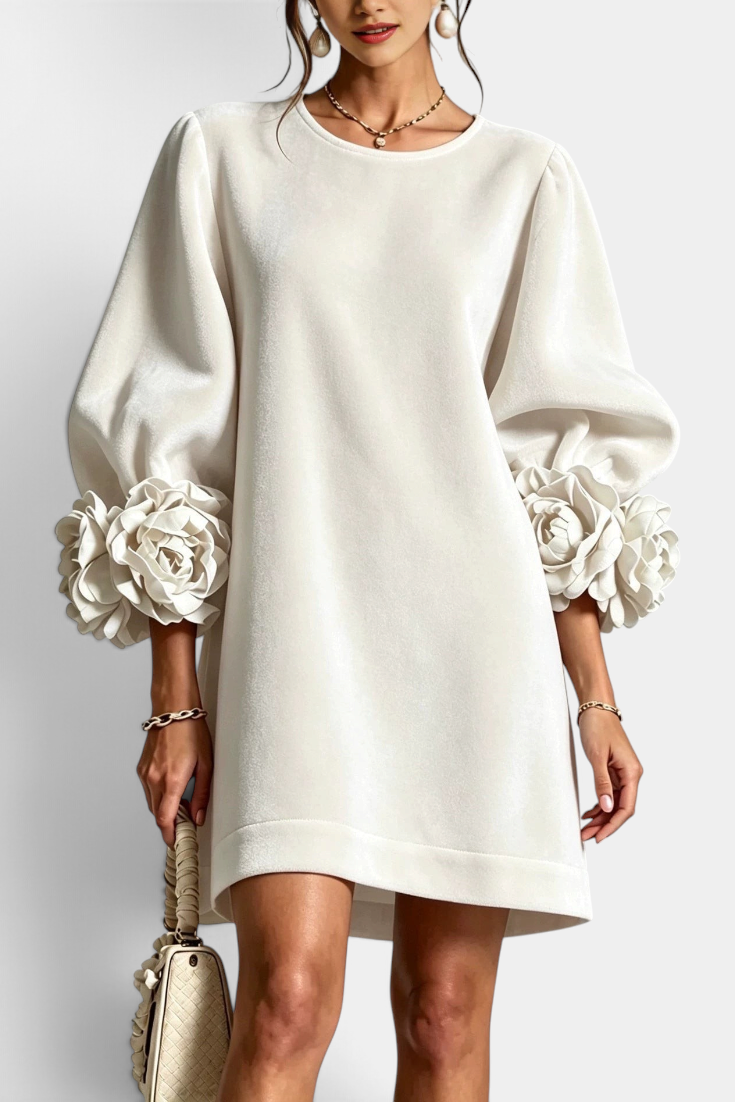 Mahaute Fuega short velvet dress in off-white with voluminous puff sleeves and 3D floral details at the cuffs.