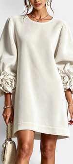 Mahaute Fuega short velvet dress in off-white with voluminous puff sleeves and 3D floral details at the cuffs.