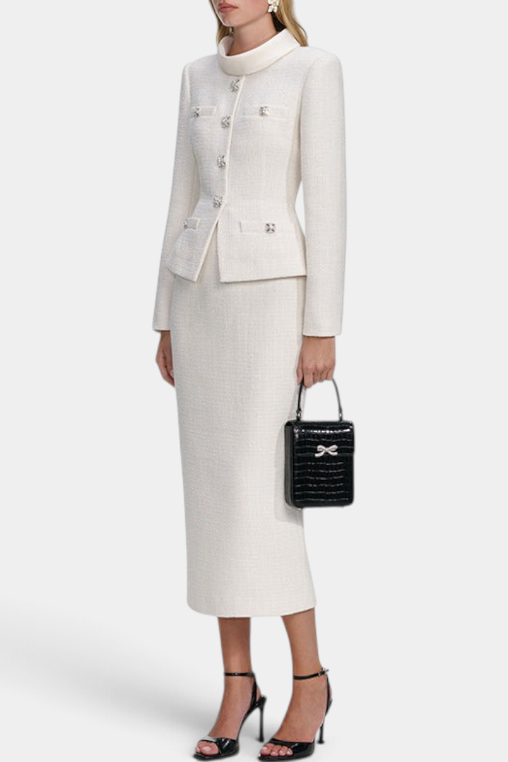 Mahaute Gergana cream tweed skirt suit with structured jacket, jewel buttons, and midi skirt on a model