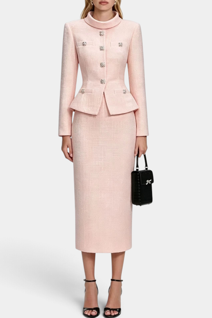 Mahaute Gergana pink tweed skirt suit with a structured peplum jacket, high collar, and sparkling jewel buttons.