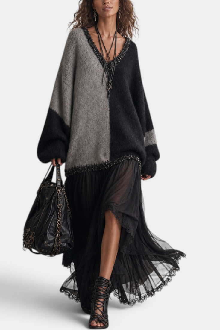 Mahaute Gingelle long two-tone knit and voile dress with V-neck, lace trim, and flowing skirt worn by a model.