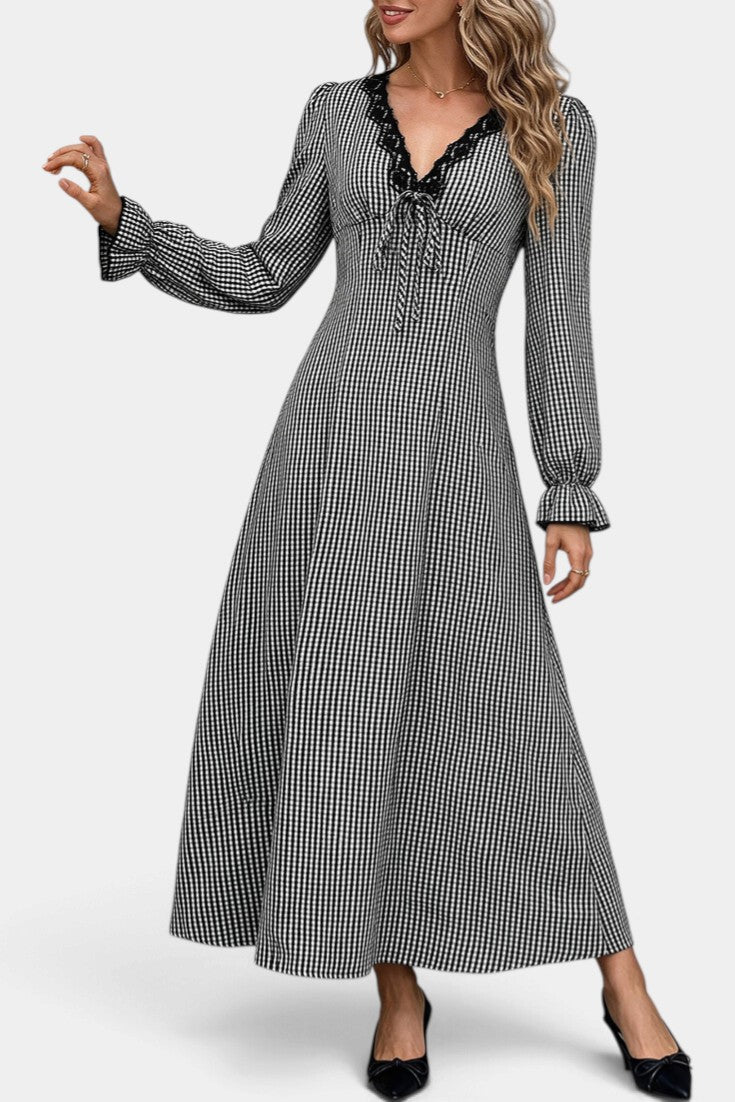 Mahaute Ethelinde long black and white gingham dress with lace-trimmed V-neck, puff sleeves, and tie-waist detail.