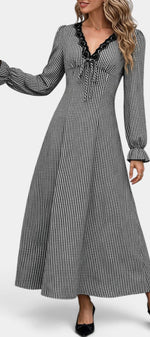 Mahaute Ethelinde long black and white gingham dress with lace-trimmed V-neck, puff sleeves, and tie-waist detail.