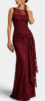 Mahaute Giuditta burgundy evening gown with floral sequins, sheer tulle neckline, and asymmetric draped hip detail.