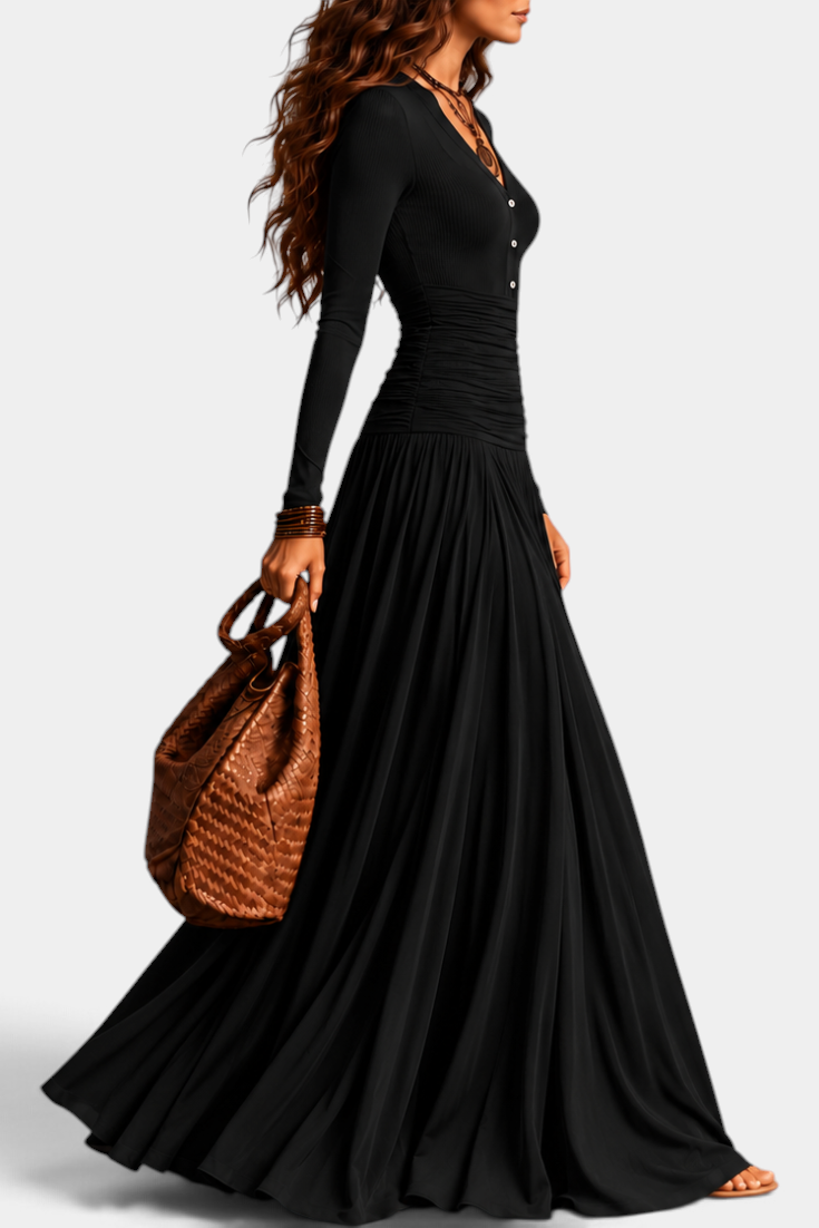 Mahaute Gracia long black dress with V-neck, buttoned bodice, ruched waist, and flowing skirt worn by a model