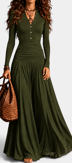 Mahaute Gracia long olive green dress with V-neck, buttoned bodice, ruched waist, and flowing skirt on a model.