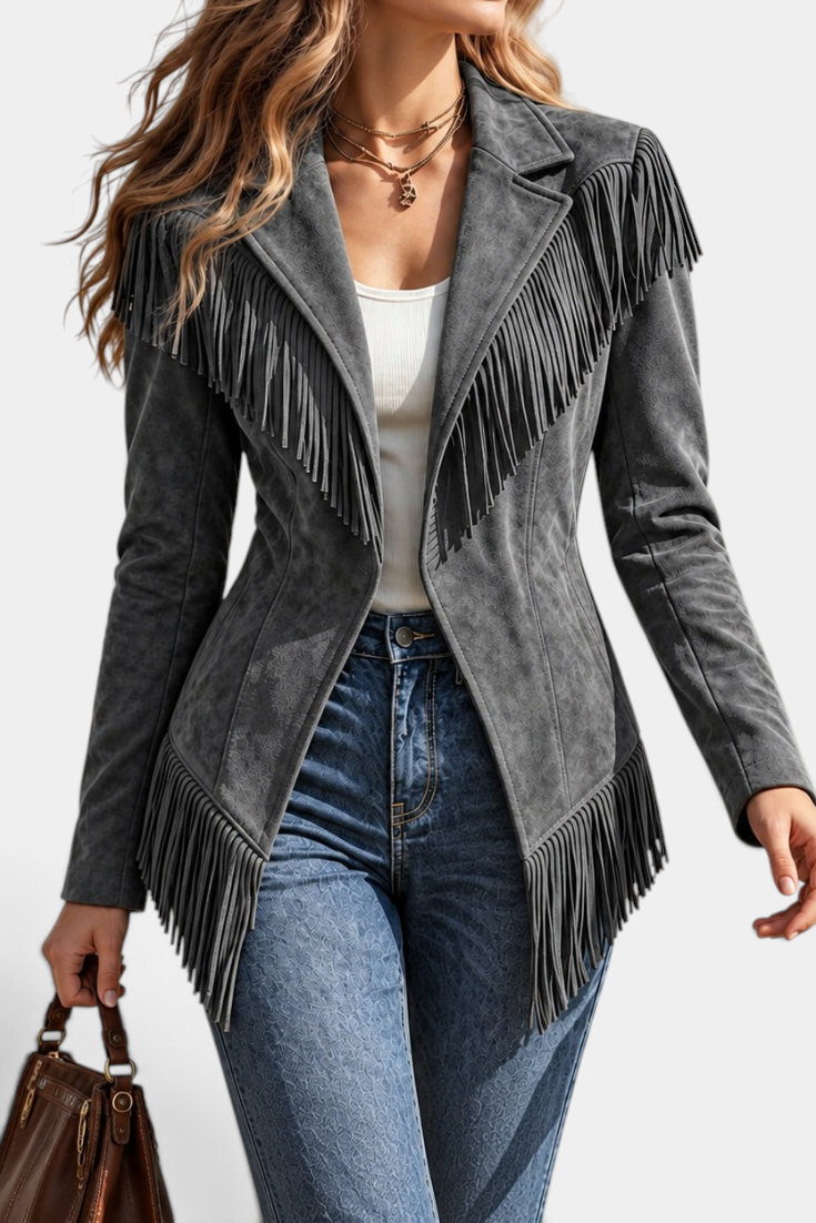 Mahaute grey faux suede fitted jacket with tailored collar and long fringe detailing on shoulders and hem.