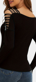 Top à manches longues Mahaute Guiomar avec épaules découpées et strass, en tissu noir élégant, pour un look sophistiqué.