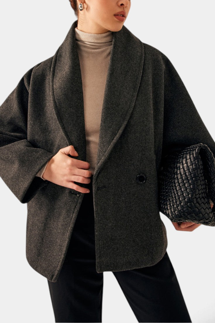 Mahaute Helena charcoal grey short coat with a wide shawl collar and double-breasted design worn by a model