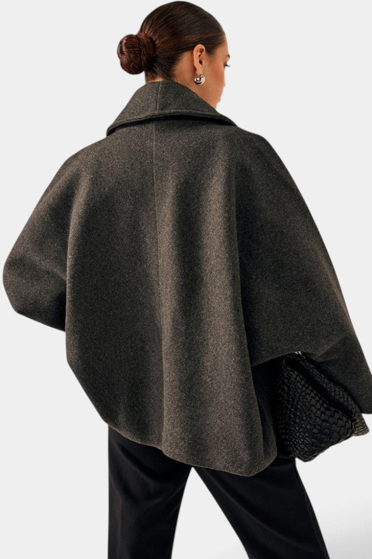 Mahaute Helena charcoal grey short coat with a wide shawl collar and loose, structured fit seen from the back
