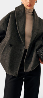 Mahaute Helena charcoal grey short wool coat with a wide shawl collar and double-breasted button closure.