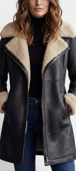 Manteau mi-long en faux cuir noir Mahaute Hildegarde avec col fourré et fermeture zippée, style élégant et moderne.