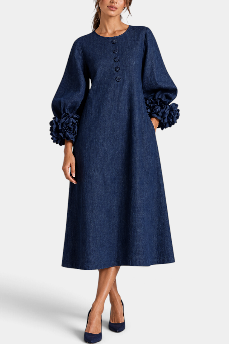 Mahaute Ikavy navy blue midi dress with puff sleeves and 3D floral cuffs, featuring decorative front buttons.