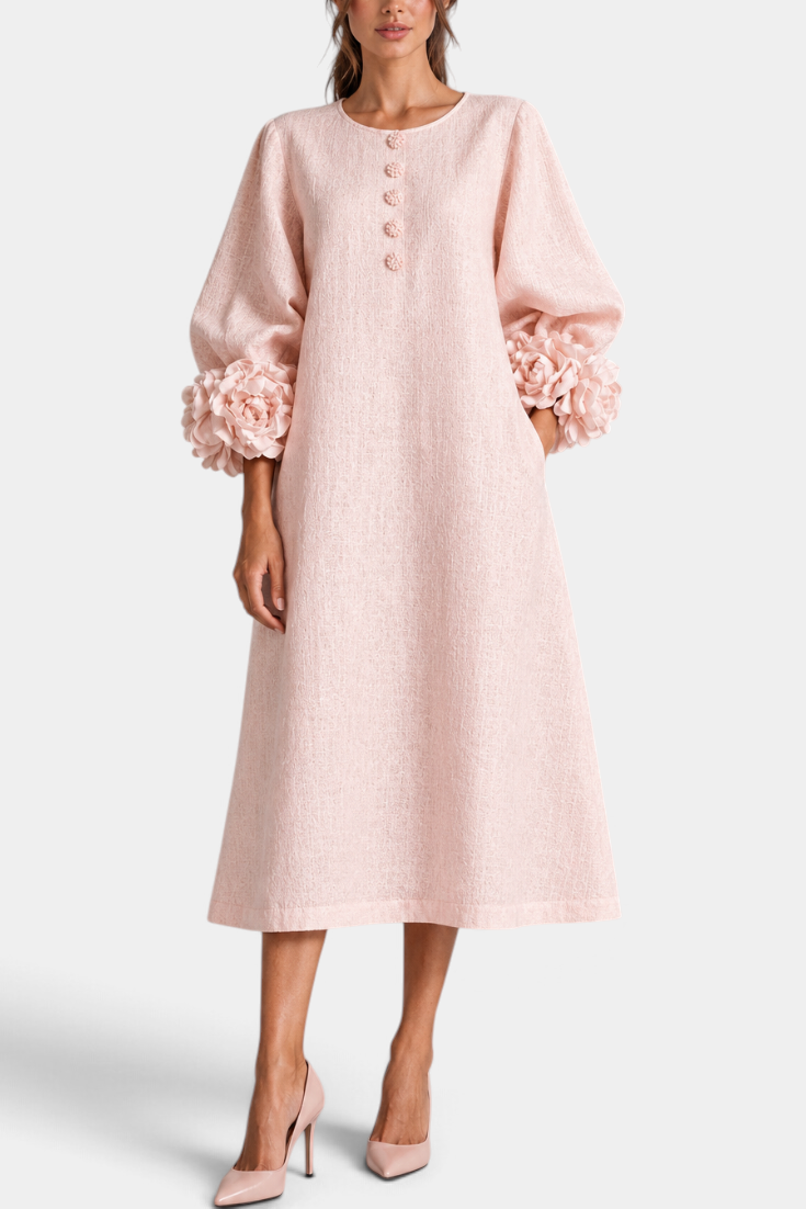 Mahaute Ikavy blush pink midi dress with puff sleeves and 3D floral cuffs, featuring decorative front buttons.