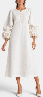 Mahaute Ikavy cream midi dress with puff sleeves, 3D floral cuffs, and decorative buttons.