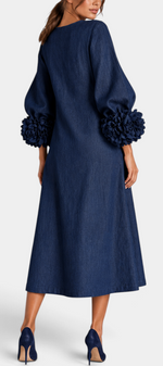 Mahaute Ikavy navy blue midi dress with puff sleeves and 3D floral cuffs, back view.