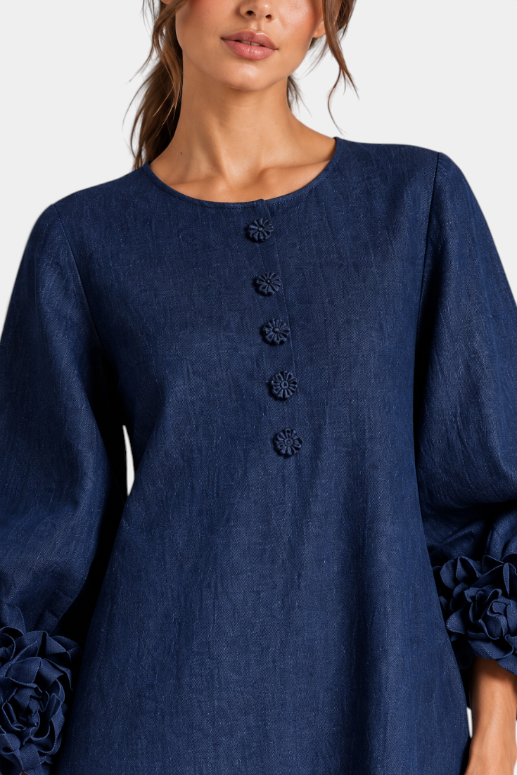 Mahaute Ikavy navy blue midi dress with puff sleeves, 3D floral cuffs, and decorative front buttons.